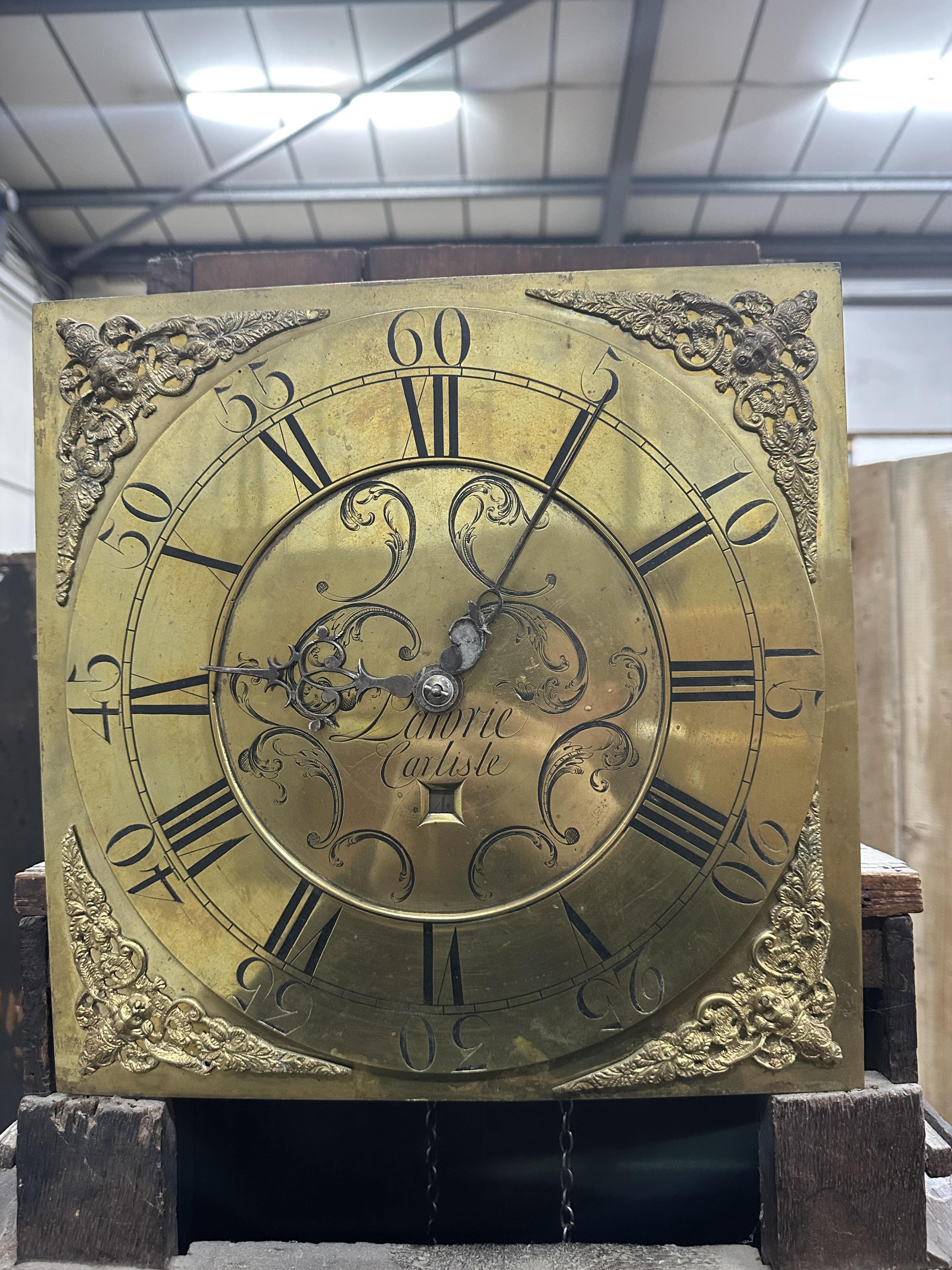 A mid 18th century oak 30 hour longcase clock, the square brass dial marked Lawrie, Carlisle, height 205cm. Condition - poor to fair